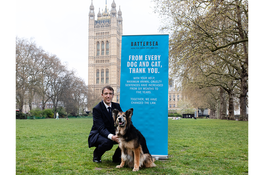 Peter Laurie with a Shepherd celebrating Animal Cruelty Sentencing