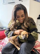 Alison holding a puppy 