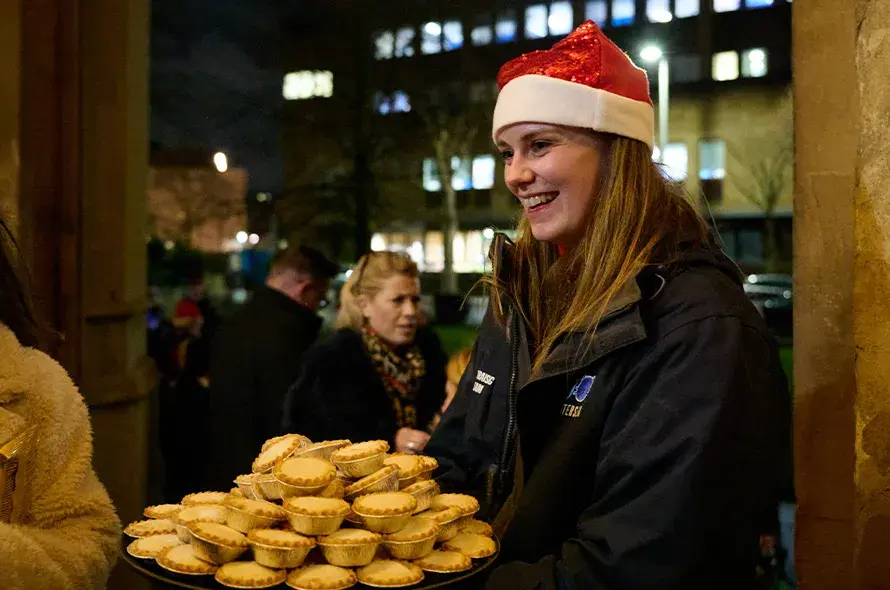 Person holding snacks at the entrance of the church