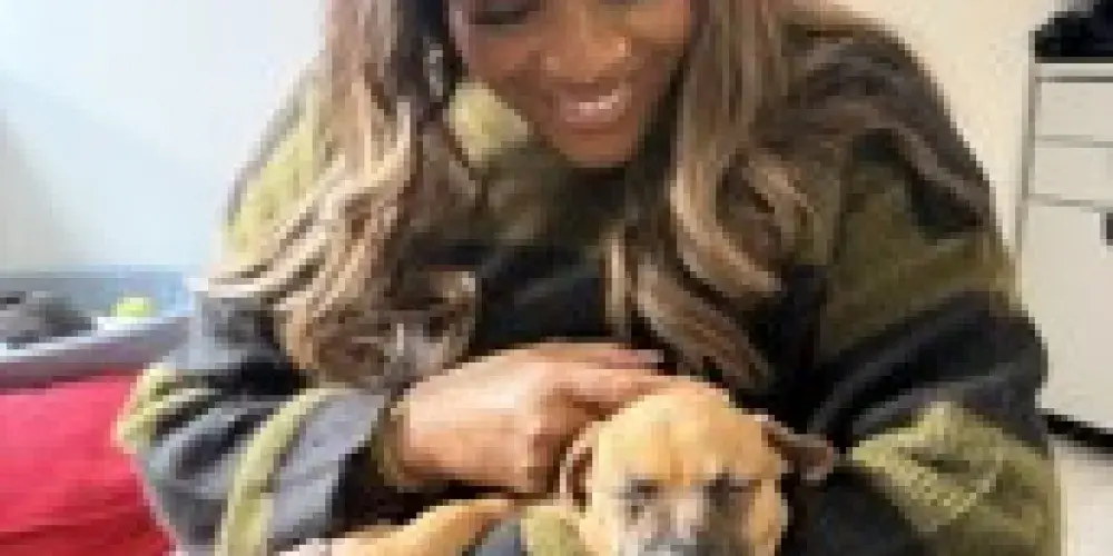 Alison holding a puppy 